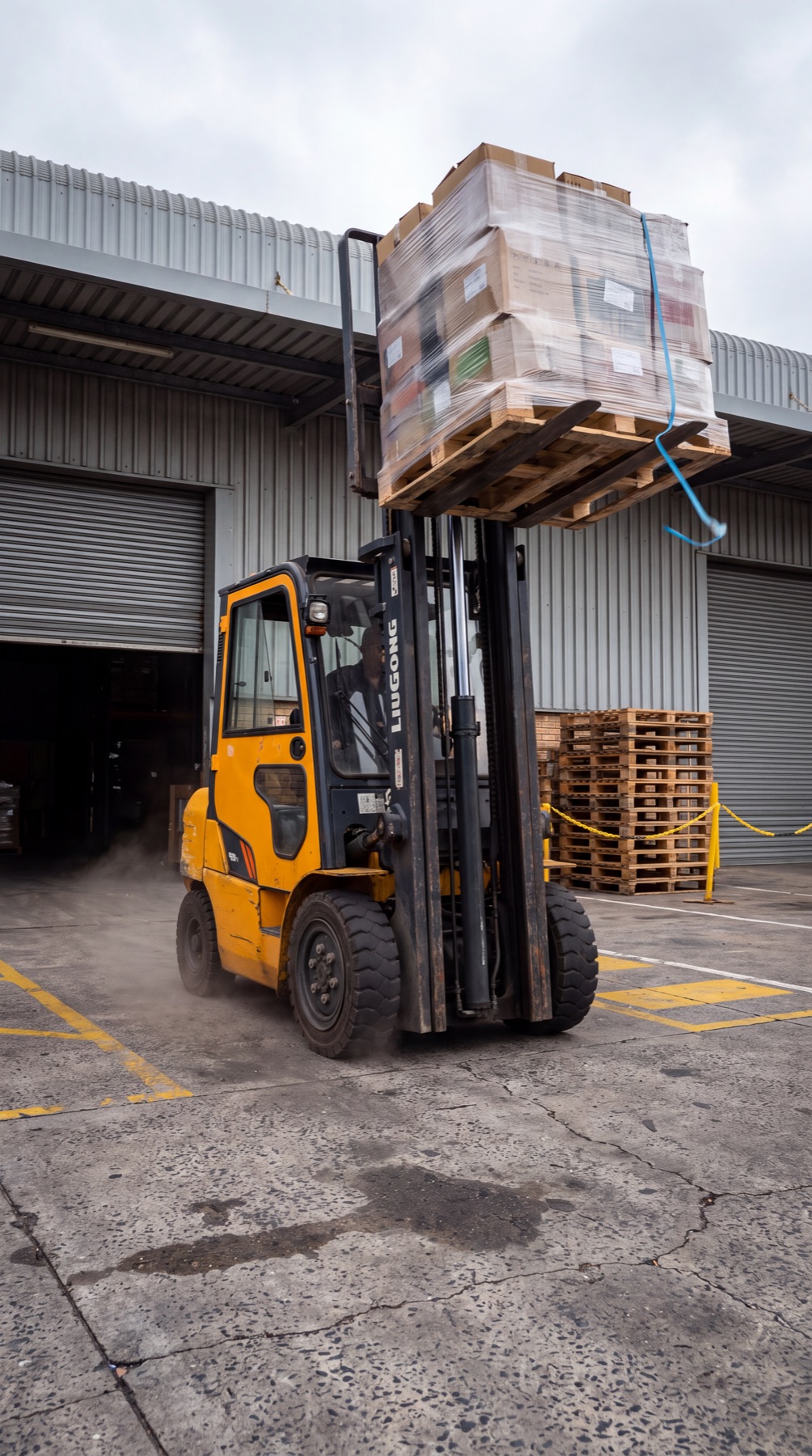 Forklift loading a delivery truck
